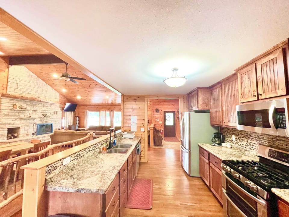Full Kitchen with Gas Stove/Oven, Refrigerator, and Dishwasher. 