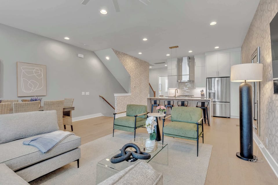*The living room features plenty of comfy seating and a large SmartTV for easy login to all your streaming services.