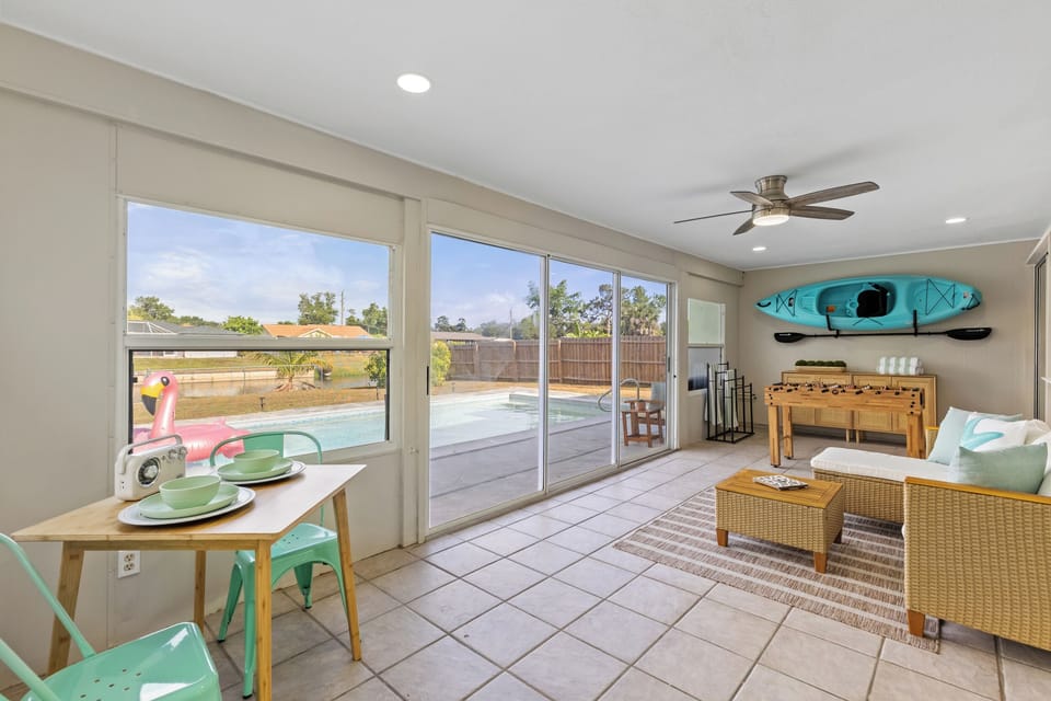 Sun room with pool view
