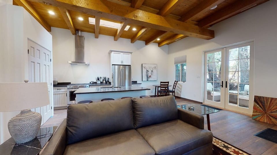 Living room with french doors leading to a private patio