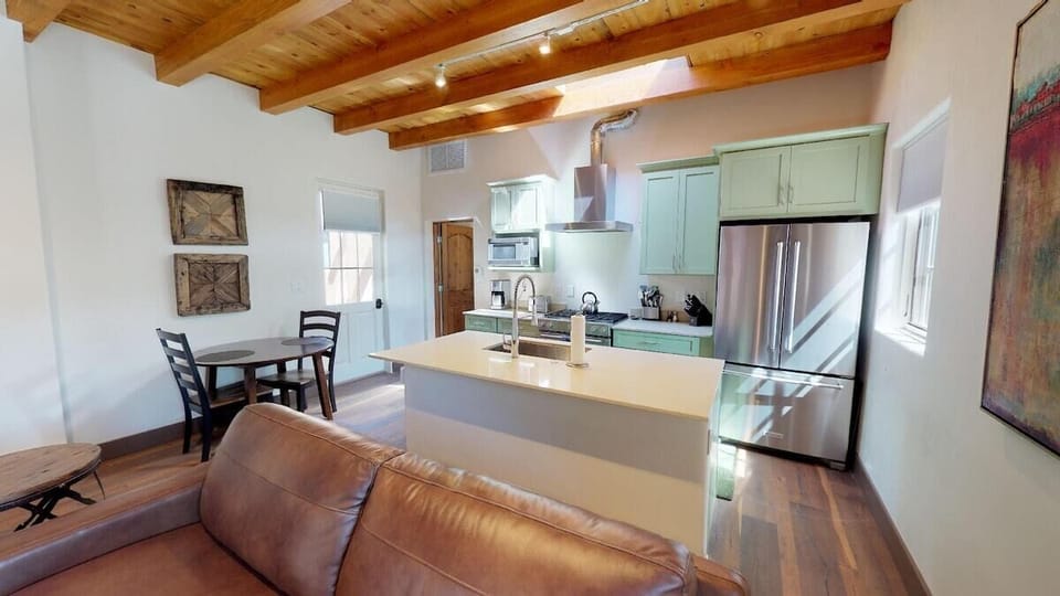 Living room and kitchen with a side dining table