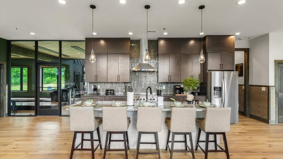 Ample of counter space in the open-concept kitchen, with direct access to the bowling/golf simulator room