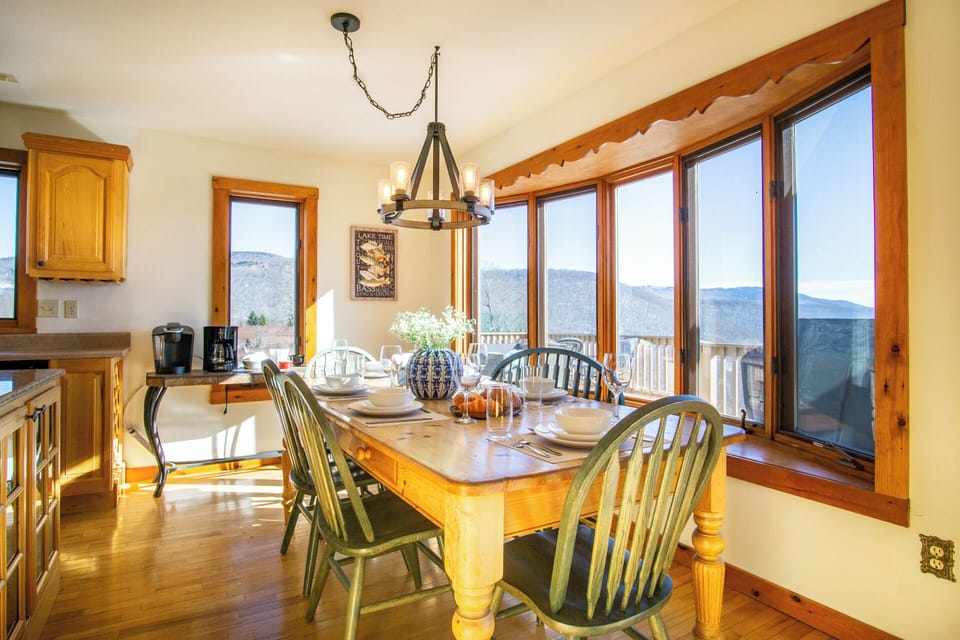 Gather with friends and family in our stunning dining room, where floor-to-ceiling windows frame panoramic mountain vistas.