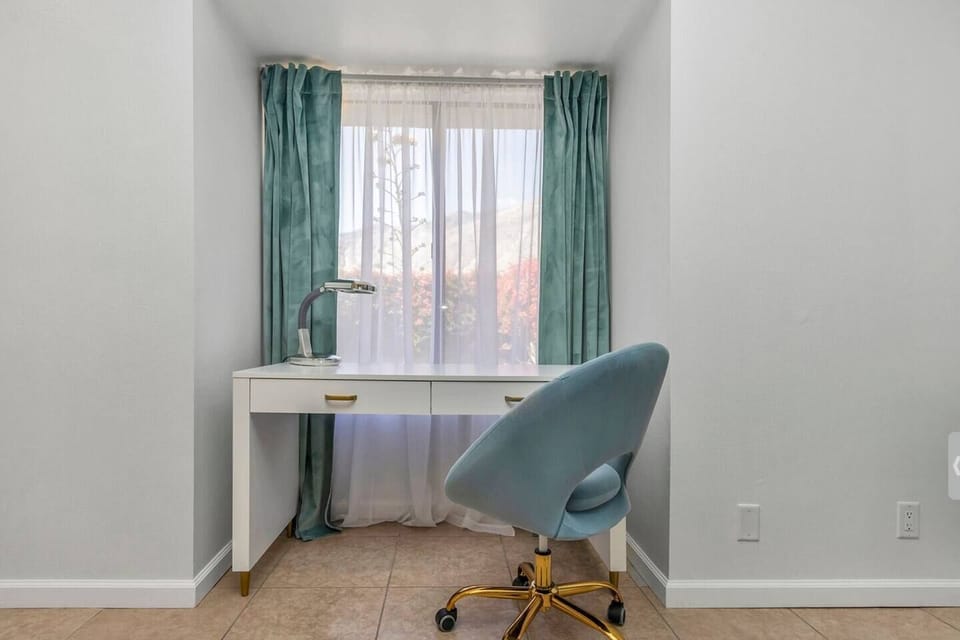 Chick desk with a comfy, velvet fabric chair.