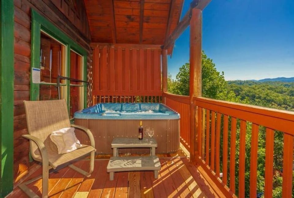Private hot tub & chair with stunning mountain views.