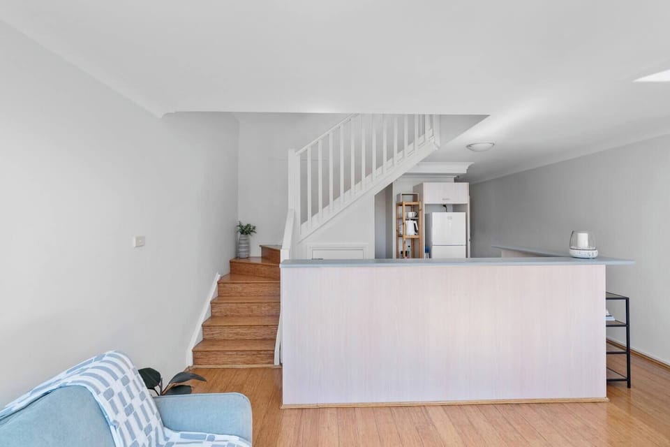 From the living area, the staircase leads you to two peaceful bedrooms.