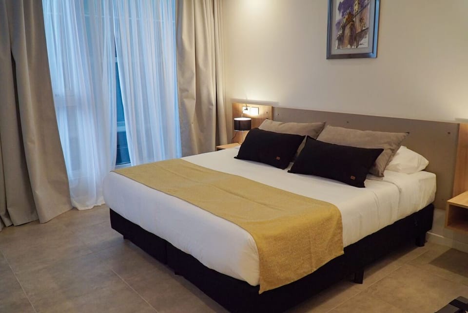 Drift off in quiet comfort with warm bedside lighting.