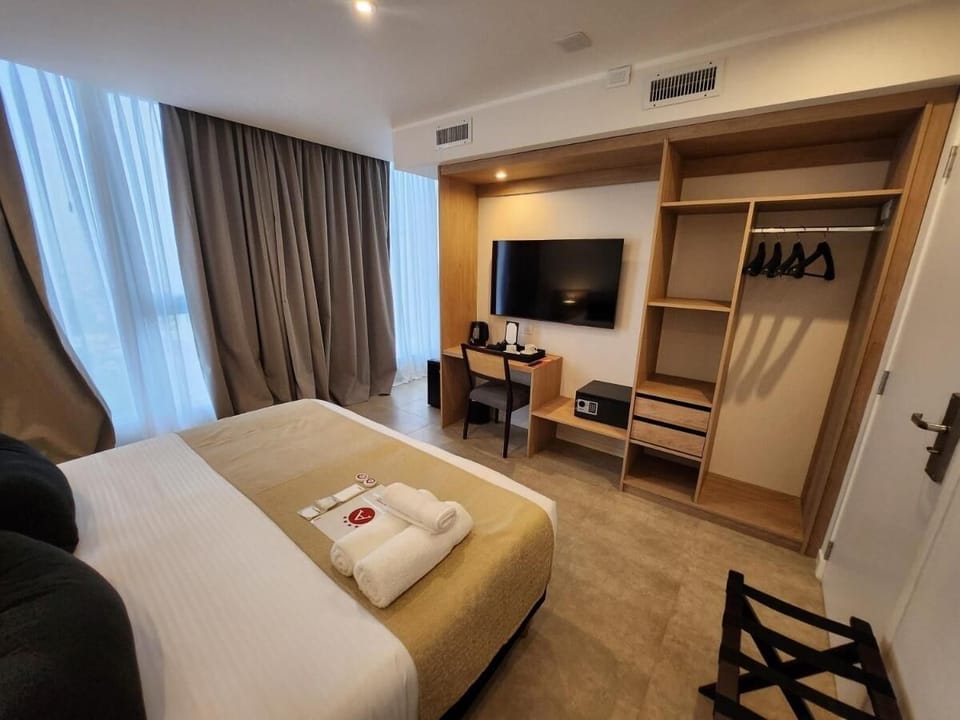 Enjoy easy storage, in-room safe, and a big-screen TV.