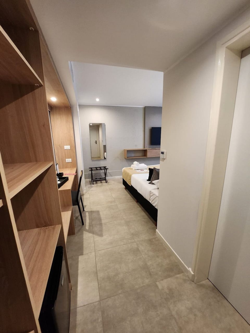 Walk into an airy layout with smart storage and easy flow.