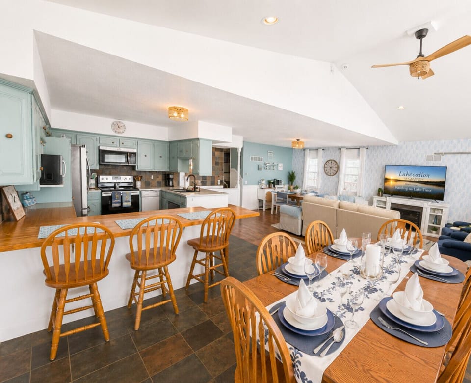 Spacious open-concept lake house with large dining area, fully stocked kitchen, and cozy living space—ideal for family gatherings and group getaways.