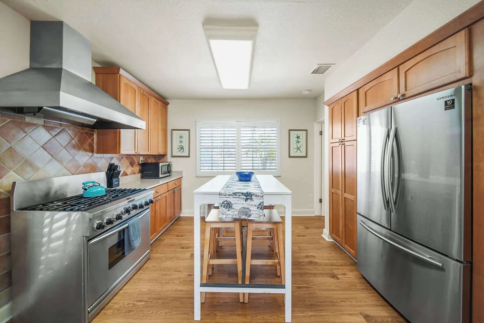 Spacious kitchen with modern appliances and a central island, perfect for family meals and entertaining.