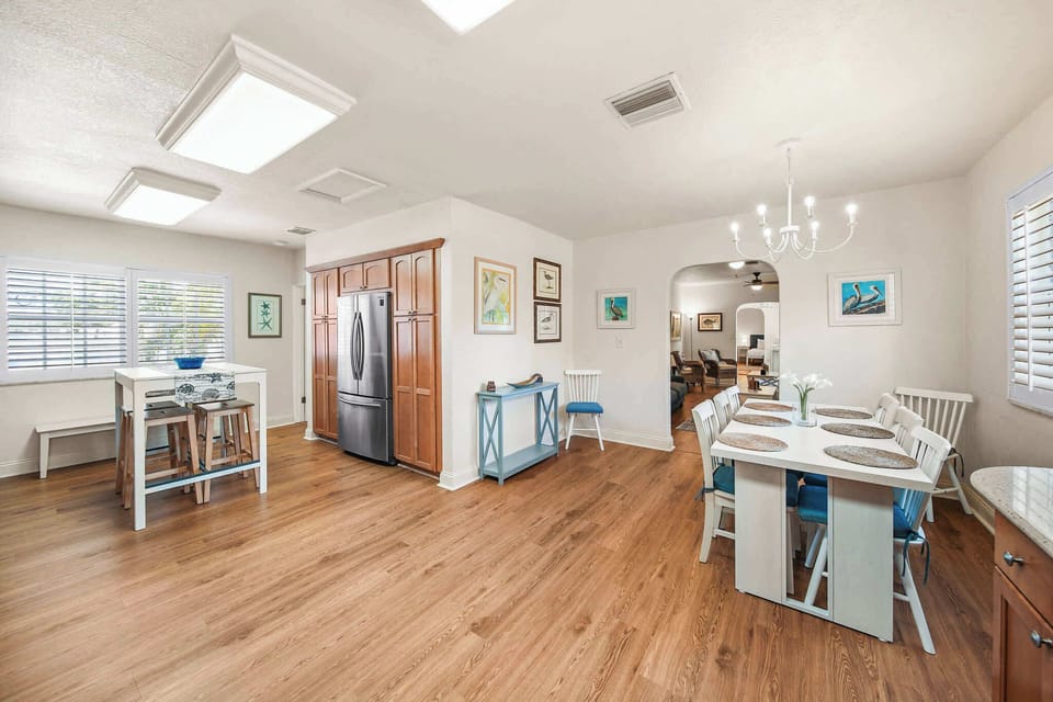 Spacious dining area with modern kitchen amenities, perfect for family meals and gatherings.