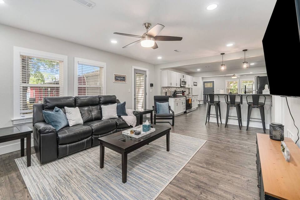 Open concept from front to back with recliner sofa.