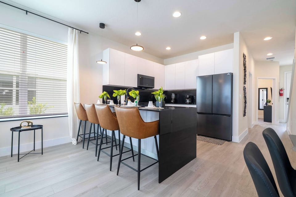 Seamless flow from kitchen to living room lets you chat with guests while preparing snacks at the island.