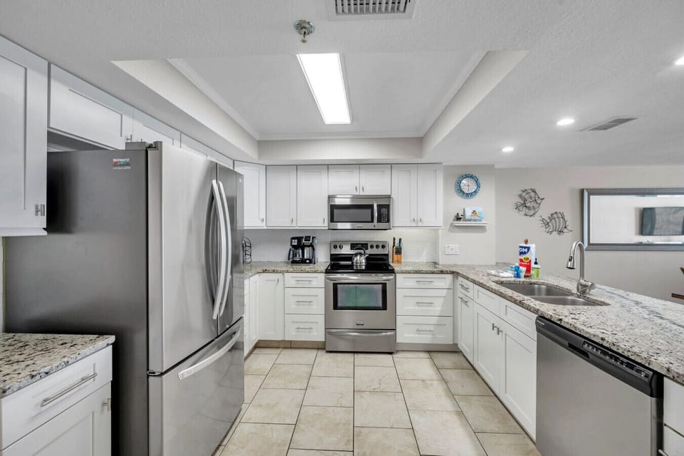 Fully equipped kitchen w/ generous counter space for cooking at home.