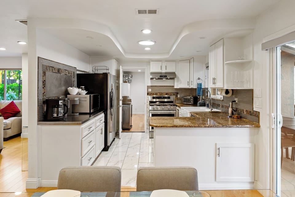 Kitchen/Dining - An open floor plan with a living room leading to dining and right to the kitchen. My kind of home!