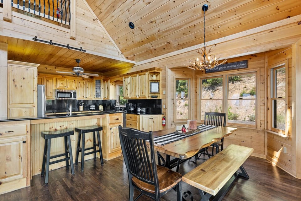 Timber and stone carry through the kitchen and dining space
