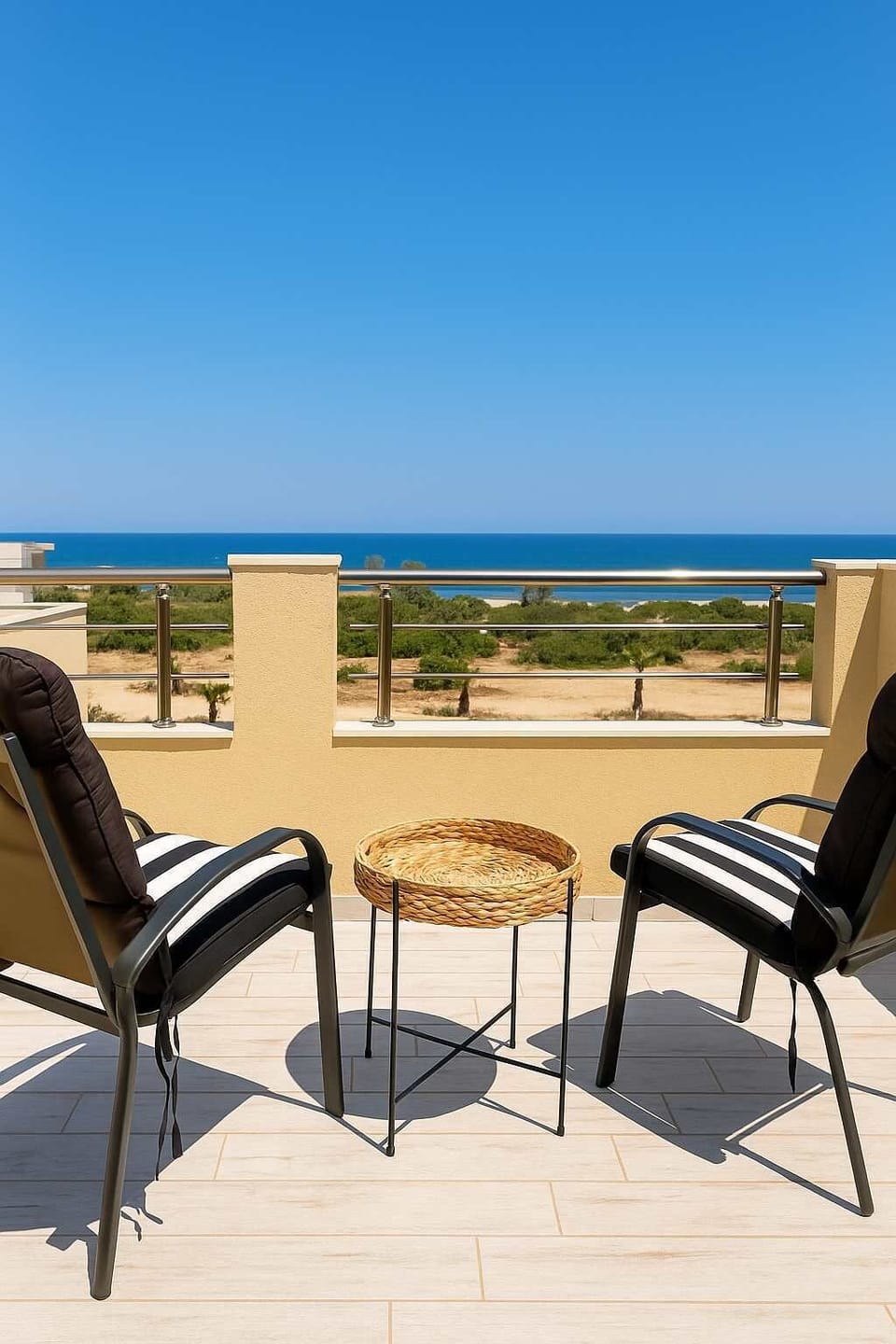 Enjoy your morning coffee with stunning panoramic views of the Aegean Sea.