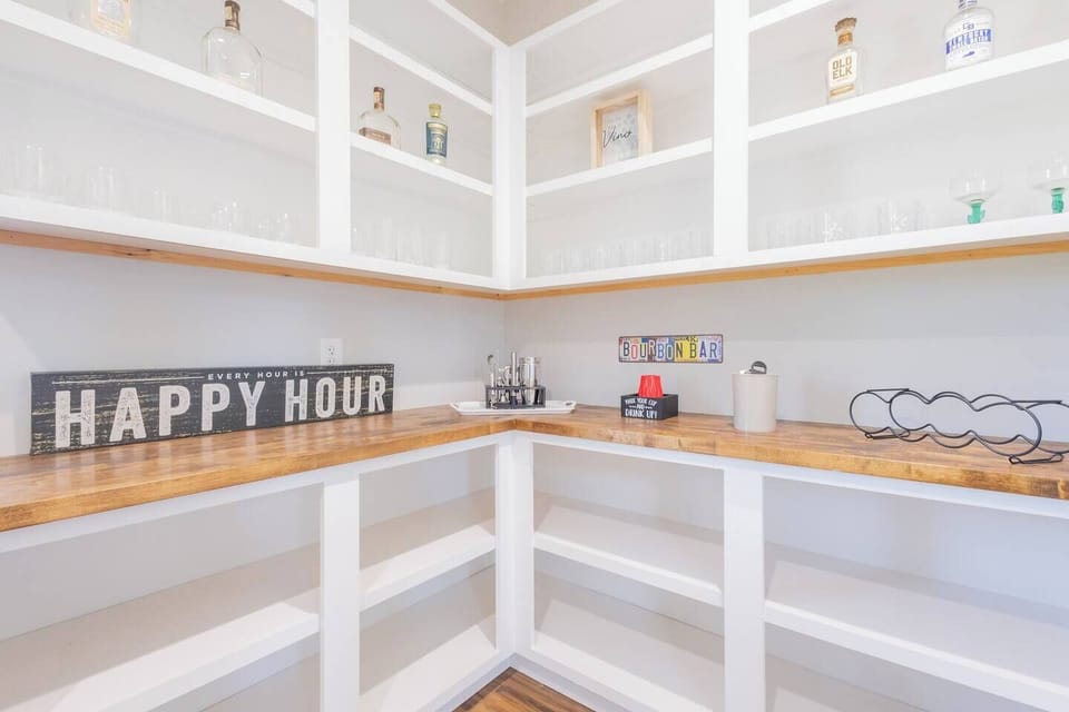 The Ultimate Happy Hour Spot – Whether you're mixing a cocktail, pouring a glass of wine, or toasting with friends, this stylish bar area has everything you need for a perfect evening.