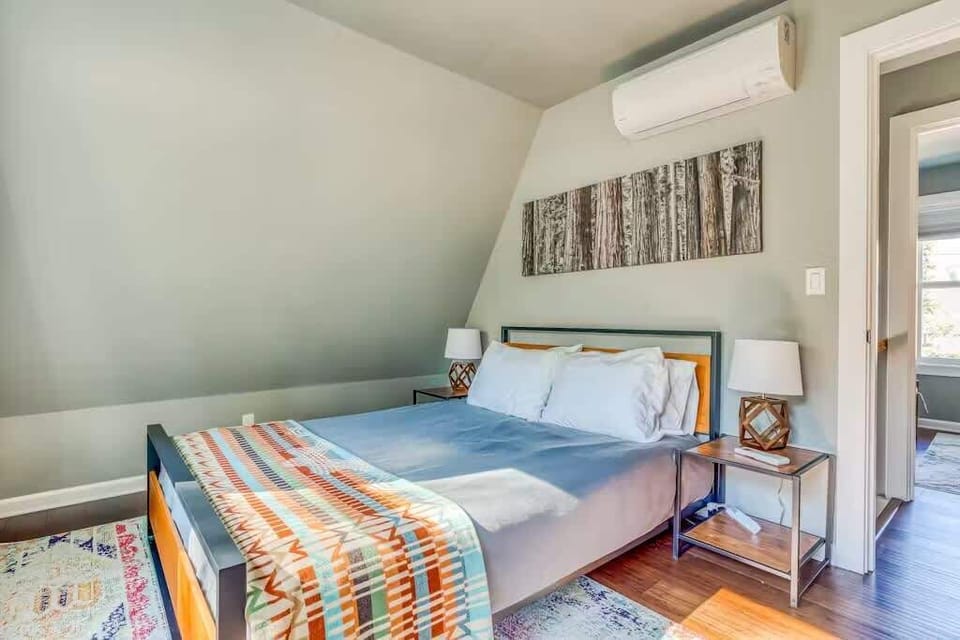 Settle into this bright, airy bedroom and enjoy a peaceful night's sleep—comfort, natural light, and cozy vibes await.
