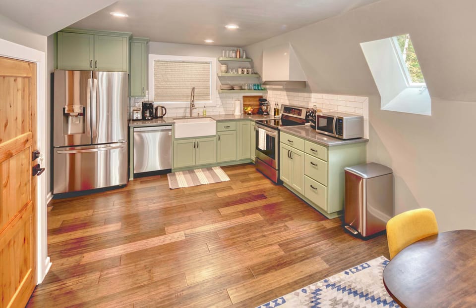 Whip up delicious meals in the charming, well-equipped kitchen! Bright and inviting for all your culinary adventures.