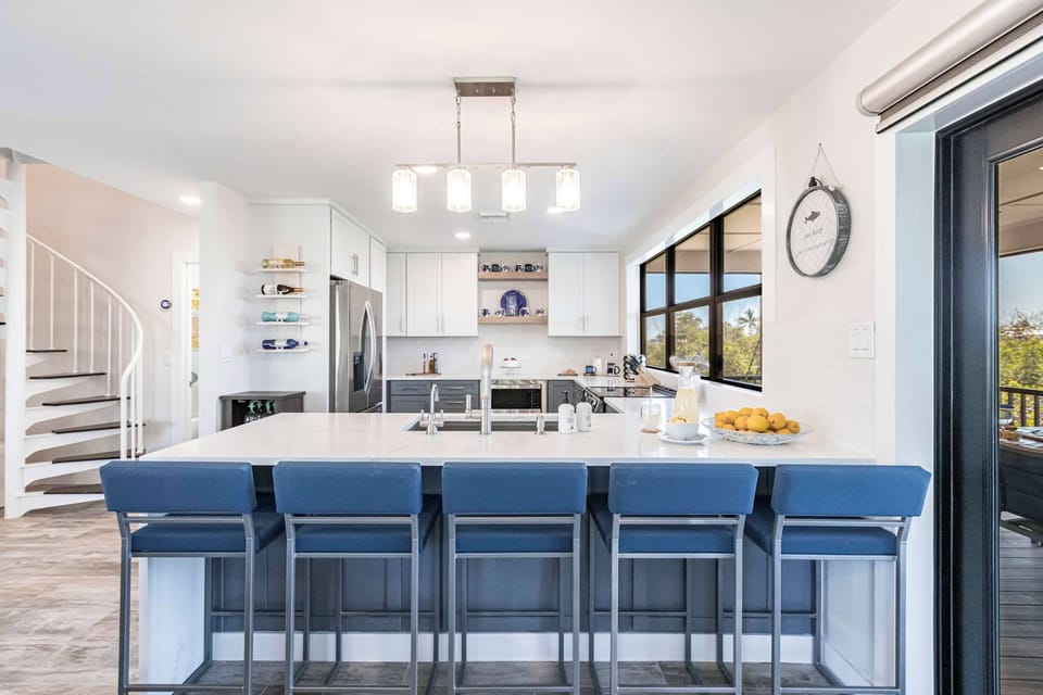 A spacious island with bar seating for five makes it the perfect spot for casual meals, morning coffee, or keeping the cook company while preparing dinner.