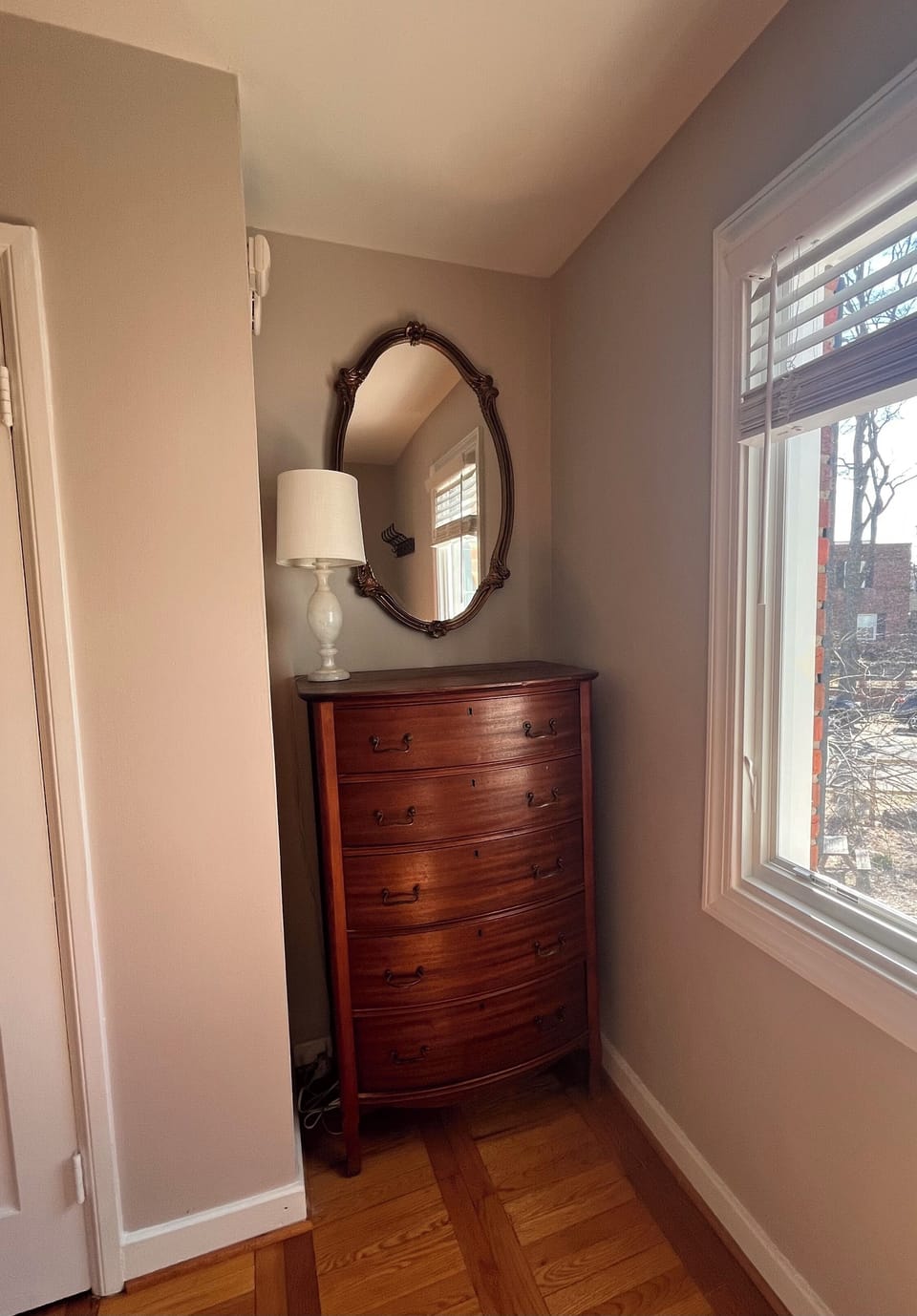 An antique highboy dresser offers lots of storage and charm.