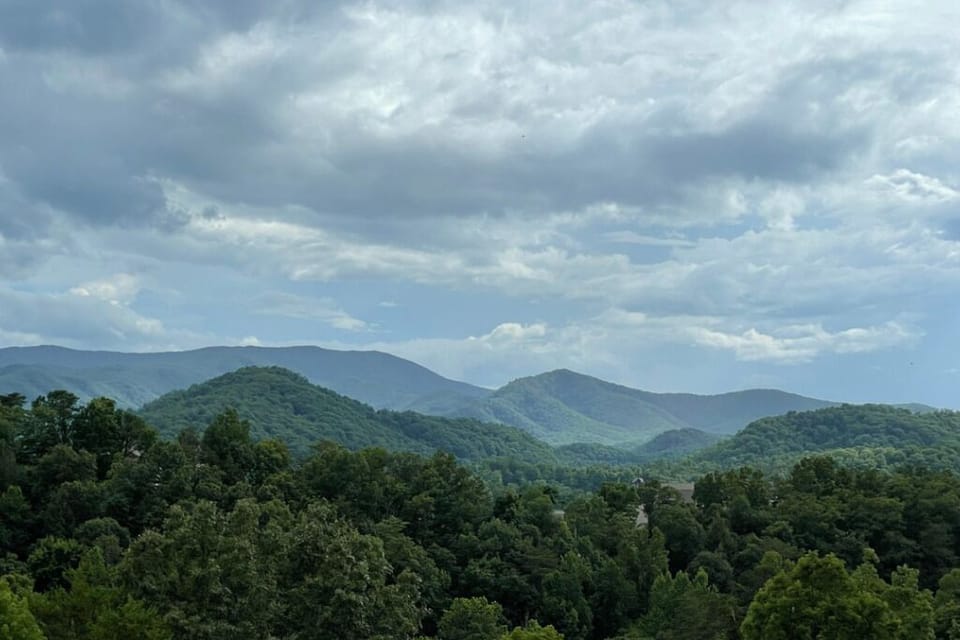 Take in the breathtaking panoramic view of rolling hills and lush forests.