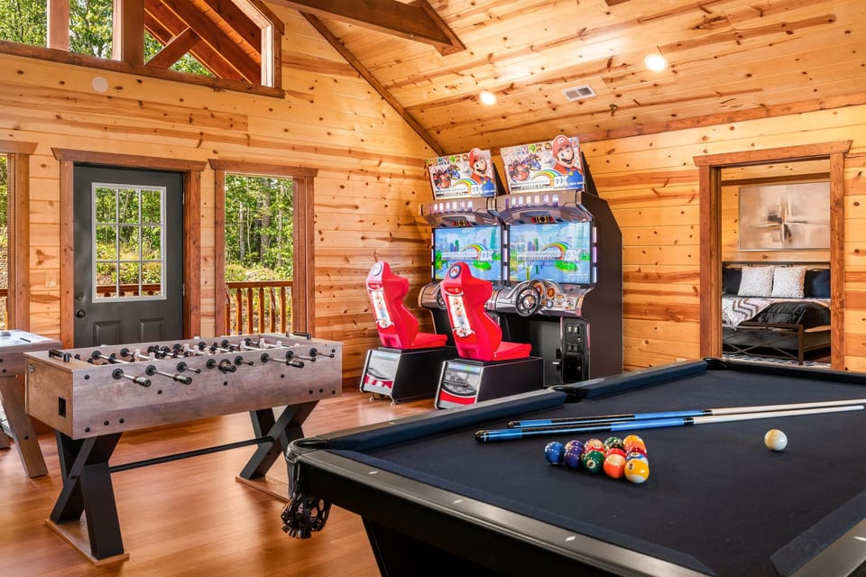 Upstairs living area, complete with a full game room setup and plenty of room to relax.