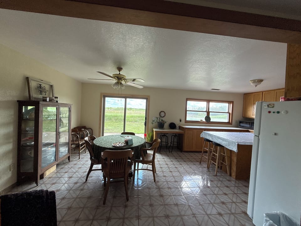 Looking at the dining room/ kitchen from the living room