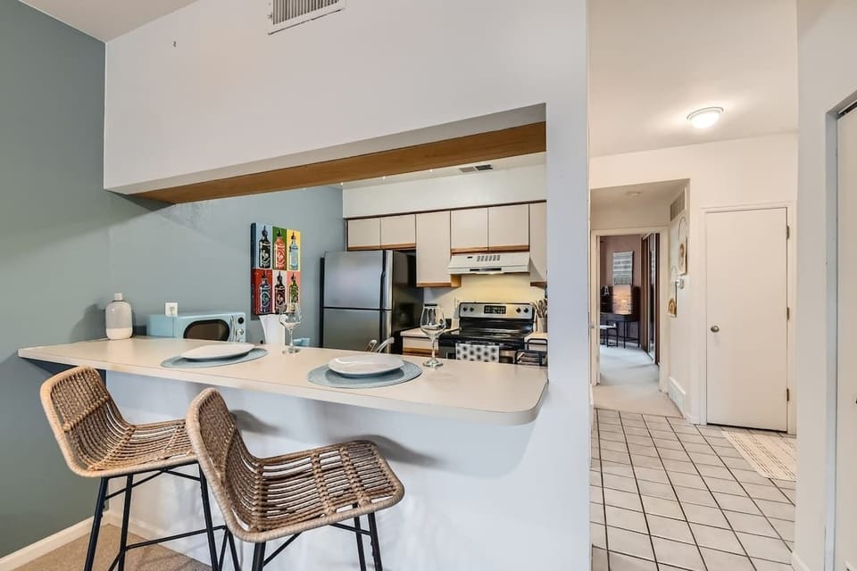 Cook with ease in a modern kitchen featuring all the appliances and tools you need for home-cooked meals.