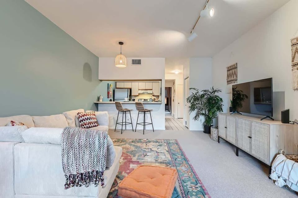 Living room with a view into the kitchen 