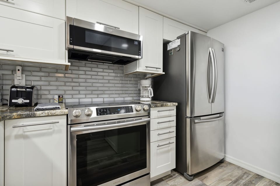 Updated Kitchen with Granite Countertops and Stainless Steel Appliances