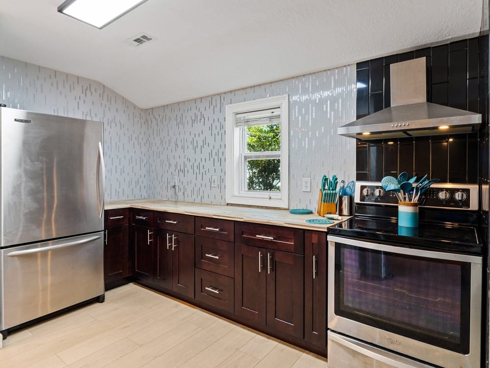Prepare a delicious meal in the Kitchen with a convenient breakfast bar offering the ideal setting for gathering after a beach day.