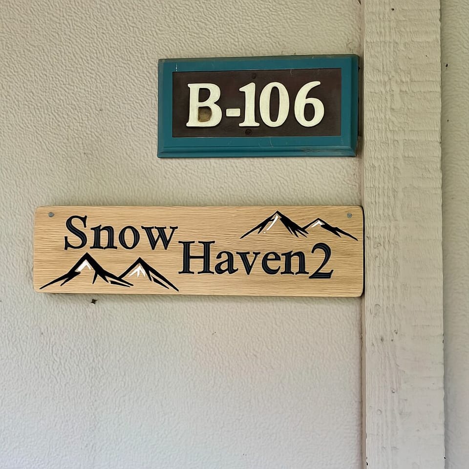 Signage outside the front door of the unit.