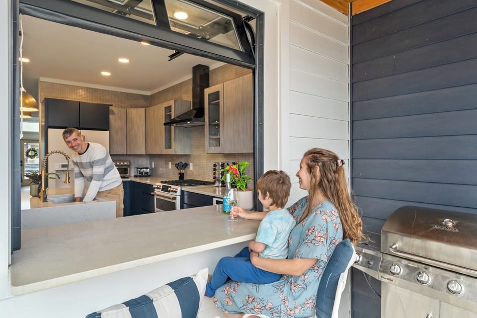 Unique garage pass-through window to grill and backyard patio for easy access .