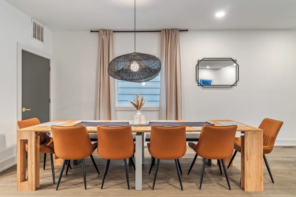 Elegant table to allow 14 people to eat together w/ a combo of benches & chairs.