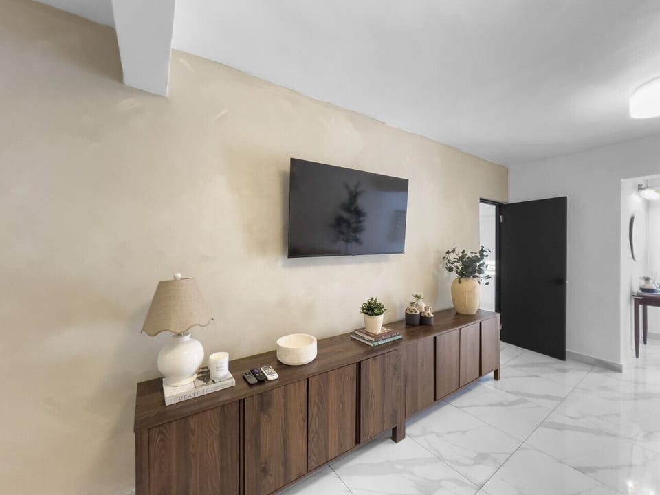 Enjoy a peaceful stay with a cozy TV space perfect for slow mornings lazy evenings and comfortable moments