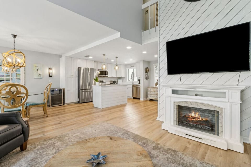 Living room with electric fireplace and cable tv