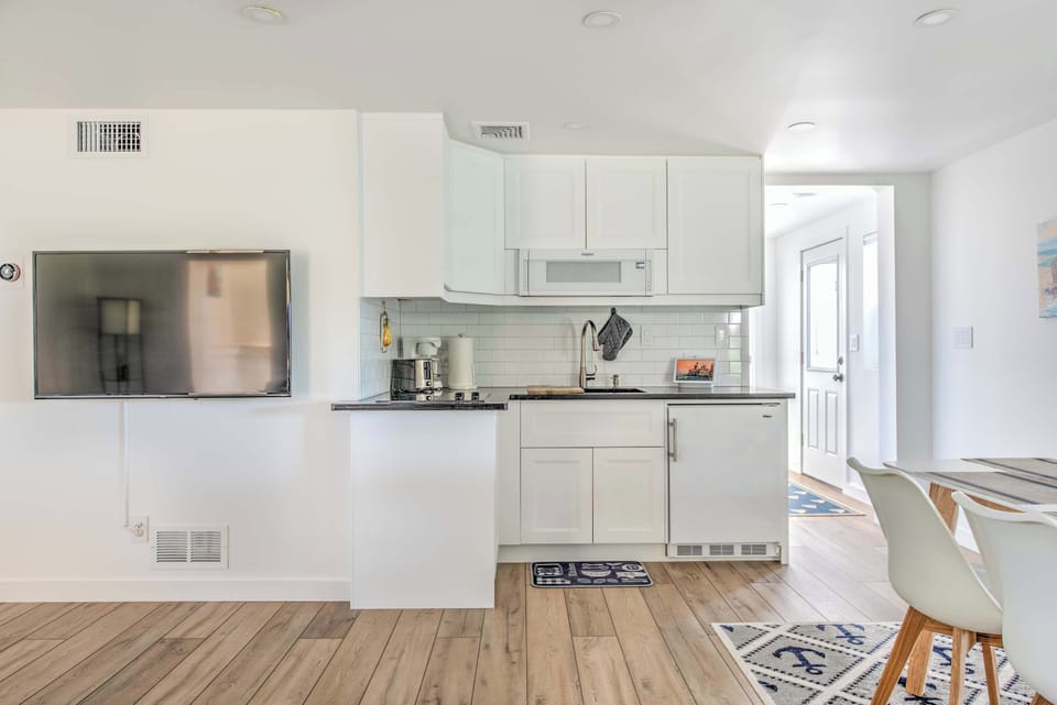 Kitchen adjacent to dining and living area