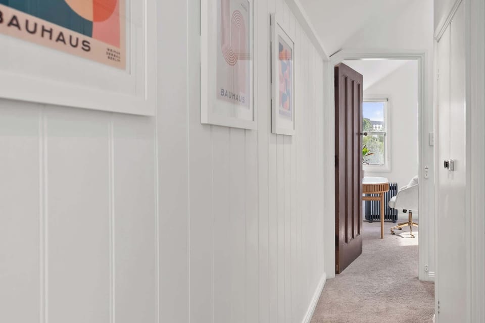 Bright and spacious first level hallway, designed for easy flow and welcoming vibes throughout the home.