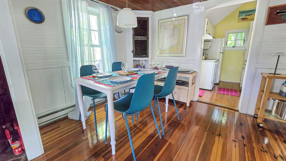 Dining area with table and seating for four