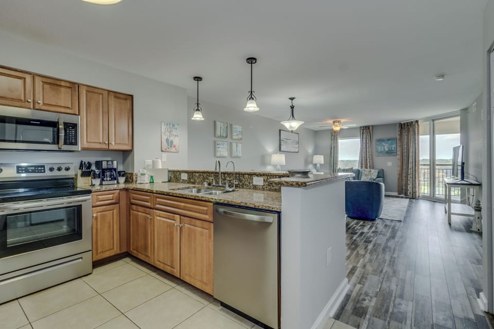 Your fully-equipped kitchen flows seamlessly into the bright living space, perfect for preparing meals and entertaining.