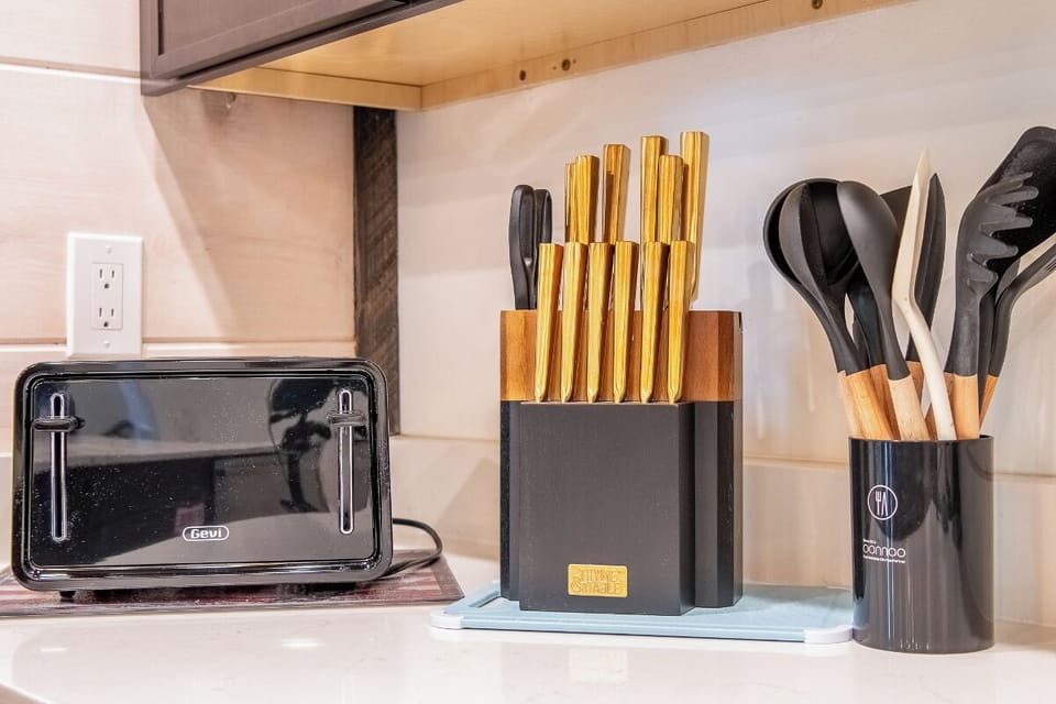 Your kitchen is stocked with everything you need, from a toaster to premium knives and utensils—ready for home-cooked meals and morning coffee rituals during your stay.