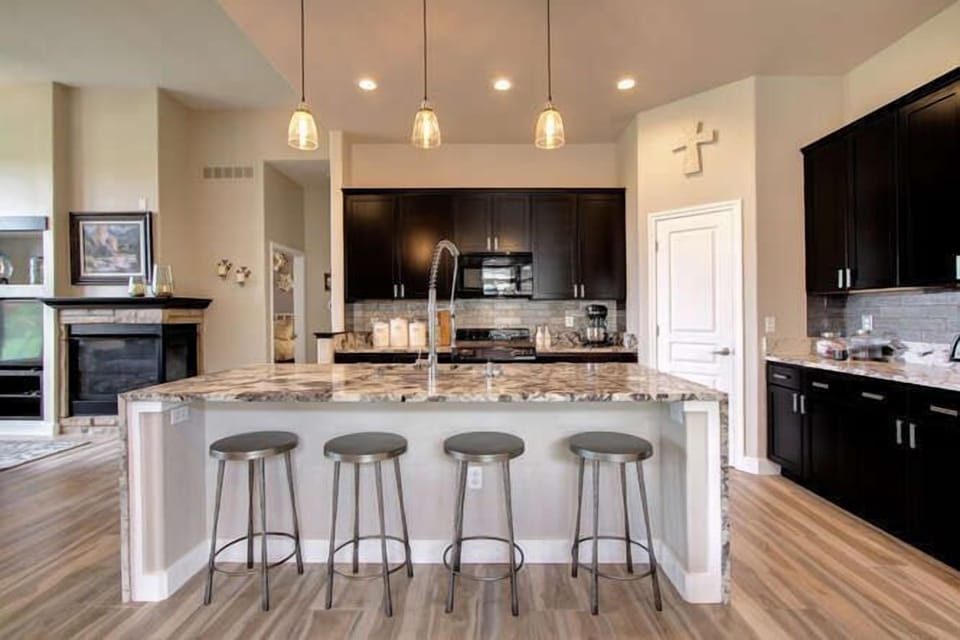 Kitchen with four bar stools which make fast meals easy 
