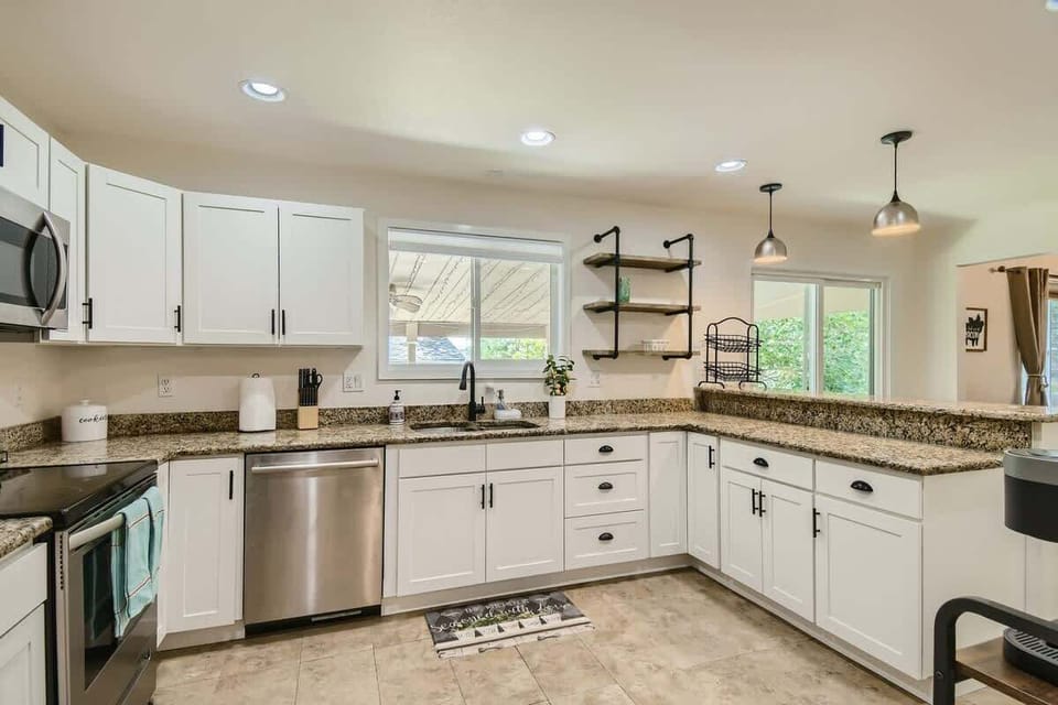 A bright and airy kitchen with ample storage, counter space, and everything you need for cooking at home.