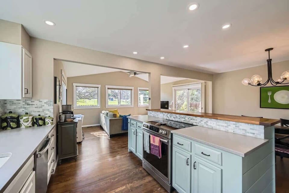 Bright kitchen stocked with cookware, utensils, and appliances, perfect for long-term stays