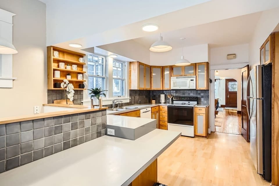 Functional kitchen with hardwood floors, perfect for cooking and comfortable living