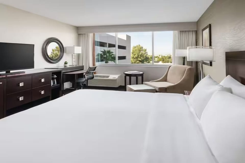 Stretch out on plush bedding with calming daylight views.