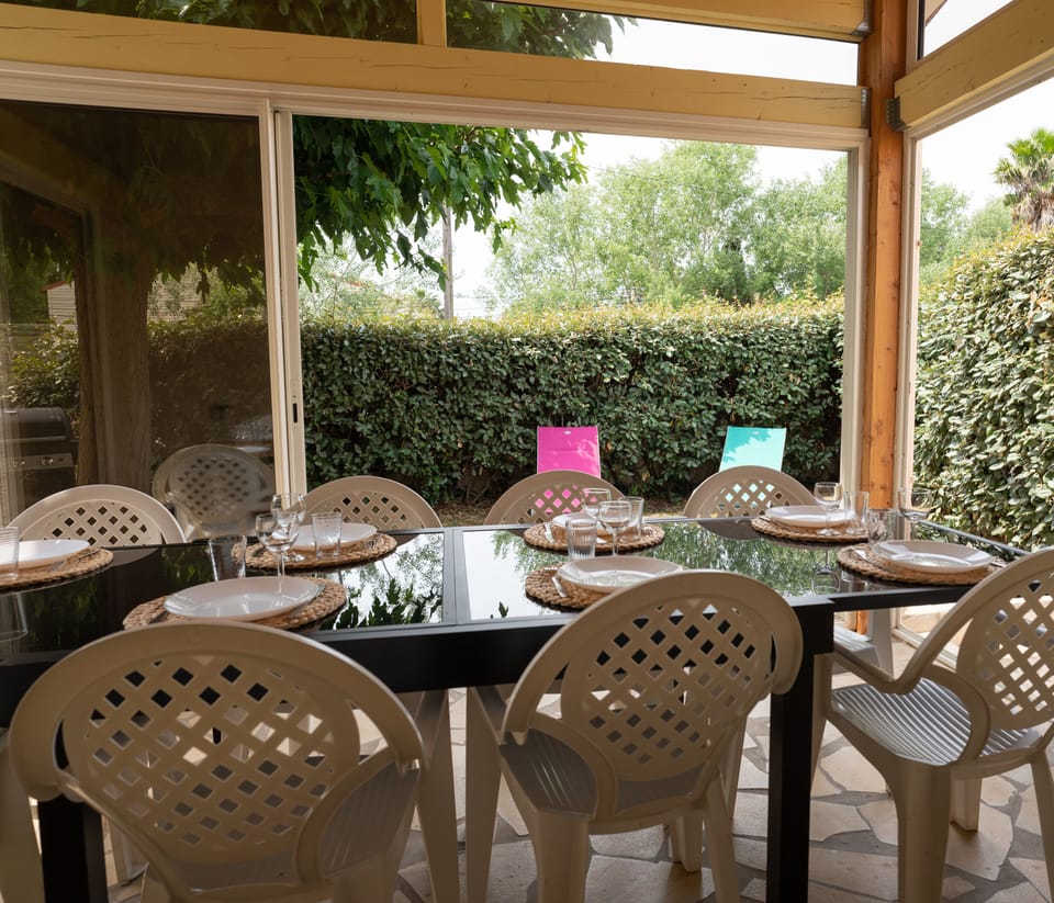 Outdoor area with large veranda and gas barbecue 